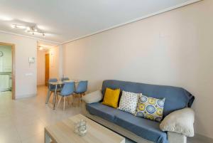 A seating area at ApartUP Patacona Palm Beach I