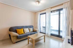 A seating area at ApartUP Patacona Palm Beach I