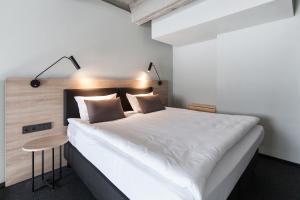 Loop Hotel Vilnius 객실 침대