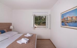 Posteľ alebo postele v izbe v ubytovaní Villa Village Idylle with heated pool, sauna, jacuzzy and private parking + 37 fotografií