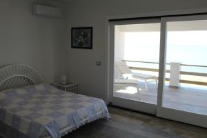 Ένα ή περισσότερα κρεβάτια σε δωμάτιο στο Home Holiday Punta Piccola