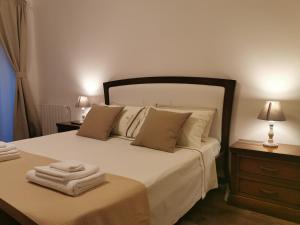 Postel nebo postele na pokoji v ubytování Eschilo Luxury House