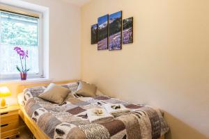 Posteľ alebo postele v izbe v ubytovaní Zakopiański Apartament