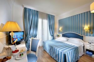 Posteľ alebo postele v izbe v ubytovaní Hotel Italia Palace