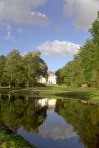 a reflection of a house in a pond at Schloss Zinzow in Zinzow