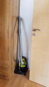 a vacuum cleaner in a room next to a door at Ferienwohnung Zauberhaft in Bad Soden-Salmünster +41 photos