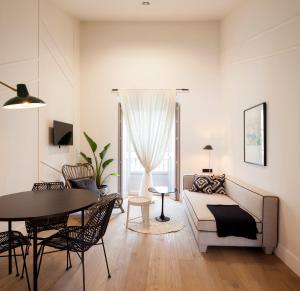 Televízia a/alebo spoločenská miestnosť v ubytovaní Casa Noa Apartments