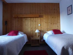 מיטה או מיטות בחדר ב-Hotel Val Joly