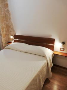 Postel nebo postele na pokoji v ubytování Historical Domus