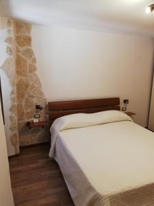 Postel nebo postele na pokoji v ubytování Historical Domus