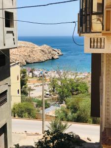 a view of the ocean from a building at Appartement vue sur mer - Al Hoceima in Al Hoceïma