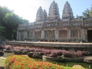 a building with some flowers in front of it at City Angkor Hotel in Siem Reap