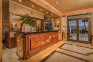a restaurant with a counter in a room at Grande Albergo in Sestri Levante