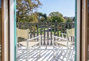 a balcony with two chairs and a table at Grande Albergo in Sestri Levante