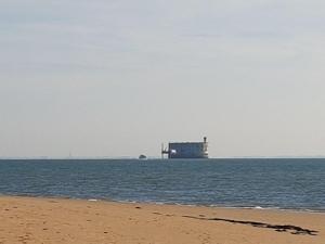 a building in the middle of the ocean with a beach at Ma Maison in Le Château-dʼOléron +3 photos