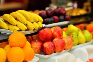 a display of fruits and vegetables on plates at Savoy Hotel Encarnación in Encarnación