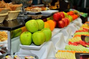a buffet of fruits and vegetables on display at Savoy Hotel Encarnación in Encarnación