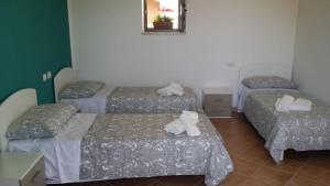 Postel nebo postele na pokoji v ubytování Albergo Diffuso di Campolattaro