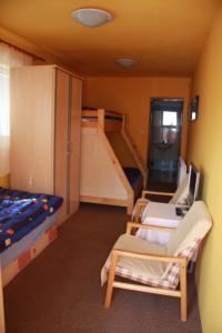 a room with two bunk beds and a staircase at Penzion W in Plzeň