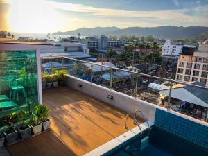 a balcony of a building with a view of a city at Centro One Bangla in Patong Beach