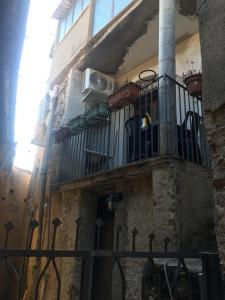 a balcony of a building with a fence at Casa Vacanze Crocevia in Badolato