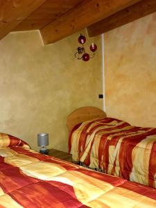 Postel nebo postele na pokoji v ubytování La Brezza del Pollino