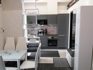 Kuchyň nebo kuchyňský kout v ubytování Corvinus Apartman