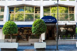 a store with two trees in front of a building at Hotel Del Angel Reforma in Mexico City
