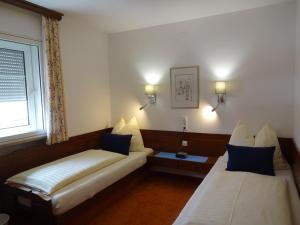 Tempat tidur dalam kamar di Hotel Schlair