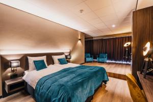 Postel nebo postele na pokoji v ubytování Hotel Hoogeveen