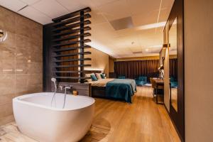 Postel nebo postele na pokoji v ubytování Hotel Hoogeveen