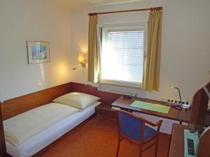 Tempat tidur dalam kamar di Hotel Schlair