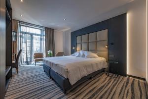 Postel nebo postele na pokoji v ubytování Hotel Monarc