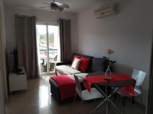 a living room with a couch and a table at Oliva Home in Los Cristianos