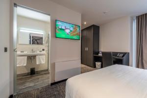 TV a/nebo společenská místnost v ubytování Hotel Monarc