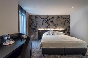 Postel nebo postele na pokoji v ubytování Hotel Monarc + 37 fotografií