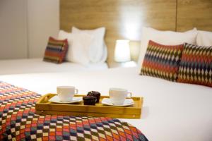 Ένα ή περισσότερα κρεβάτια σε δωμάτιο στο Alko Hotel Integrado