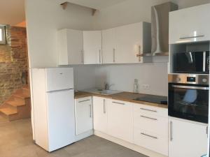 Η κουζίνα ή μικρή κουζίνα στο Gite Bord de Mer 80 m2 +7 φωτογραφίες