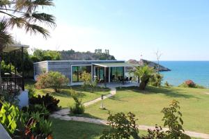 a house with a view of the ocean at Palm Beach Şile Villa Hotels in Şile +19 photos