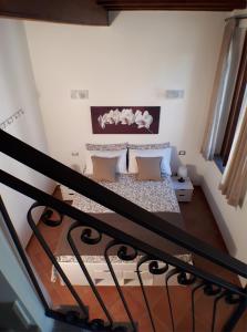 Posteľ alebo postele v izbe v ubytovaní Alloggio turistico La Casa del Vignola