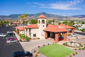 an aerial view of a church with cars parked in a parking lot at Lux Verde Hotel in Cottonwood