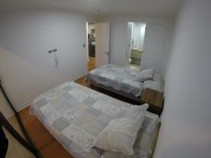 Postel nebo postele na pokoji v ubytování DEPTO SUITE CENTRO I