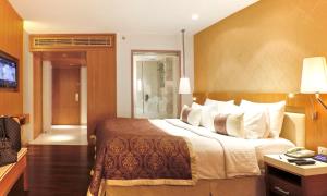 Postel nebo postele na pokoji v ubytování Hotel Bawa International