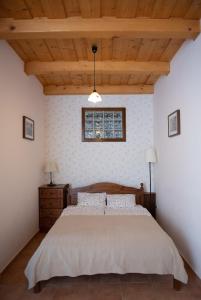 En eller flere senge i et værelse på Levendula Apartman