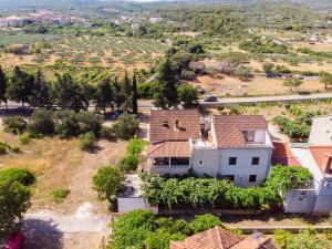 an aerial view of a house in a vineyard at Apartments Jakov in Mirce