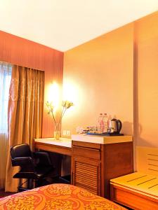 Postel nebo postele na pokoji v ubytování Hotel Bawa International