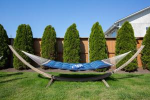 a hammock in a yard next to a fence at The Ocean Resort Inn in Montauk