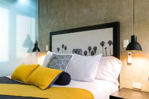 Postel nebo postele na pokoji v ubytování Epic Boutique Hotel