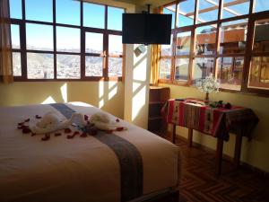 Giường trong phòng chung tại Kuska Hostal