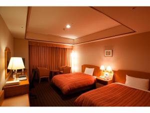 Postel nebo postele na pokoji v ubytování Hotel Mielparque Nagoya
